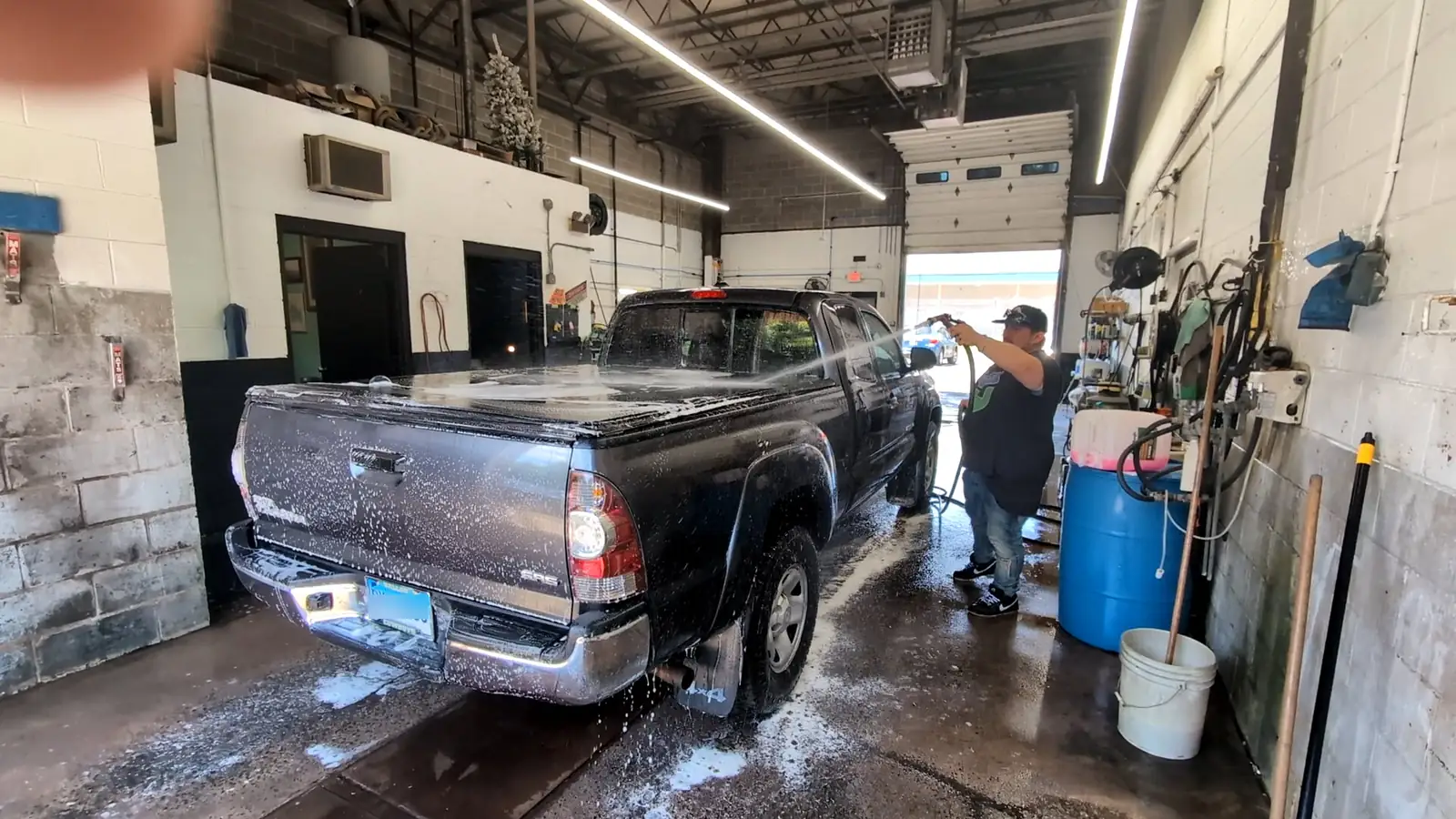 Detailing a pickup truck in the shop